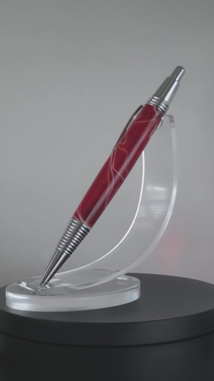 Red and White hand turned resin click rollerball pen.