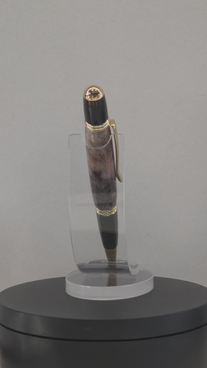 Twist Rollerball pen. Hand turned resin barrel with gold plated trims and clip