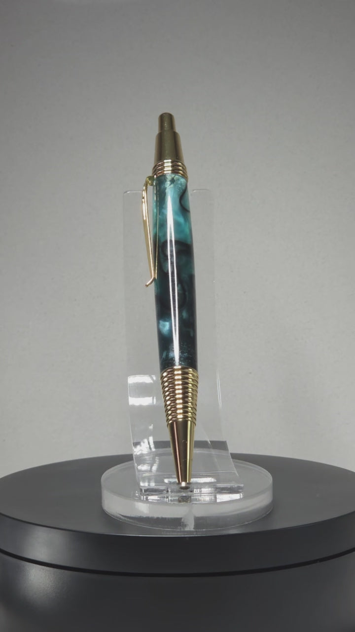 Blue and Gold hand turned resin click rollerball pen.