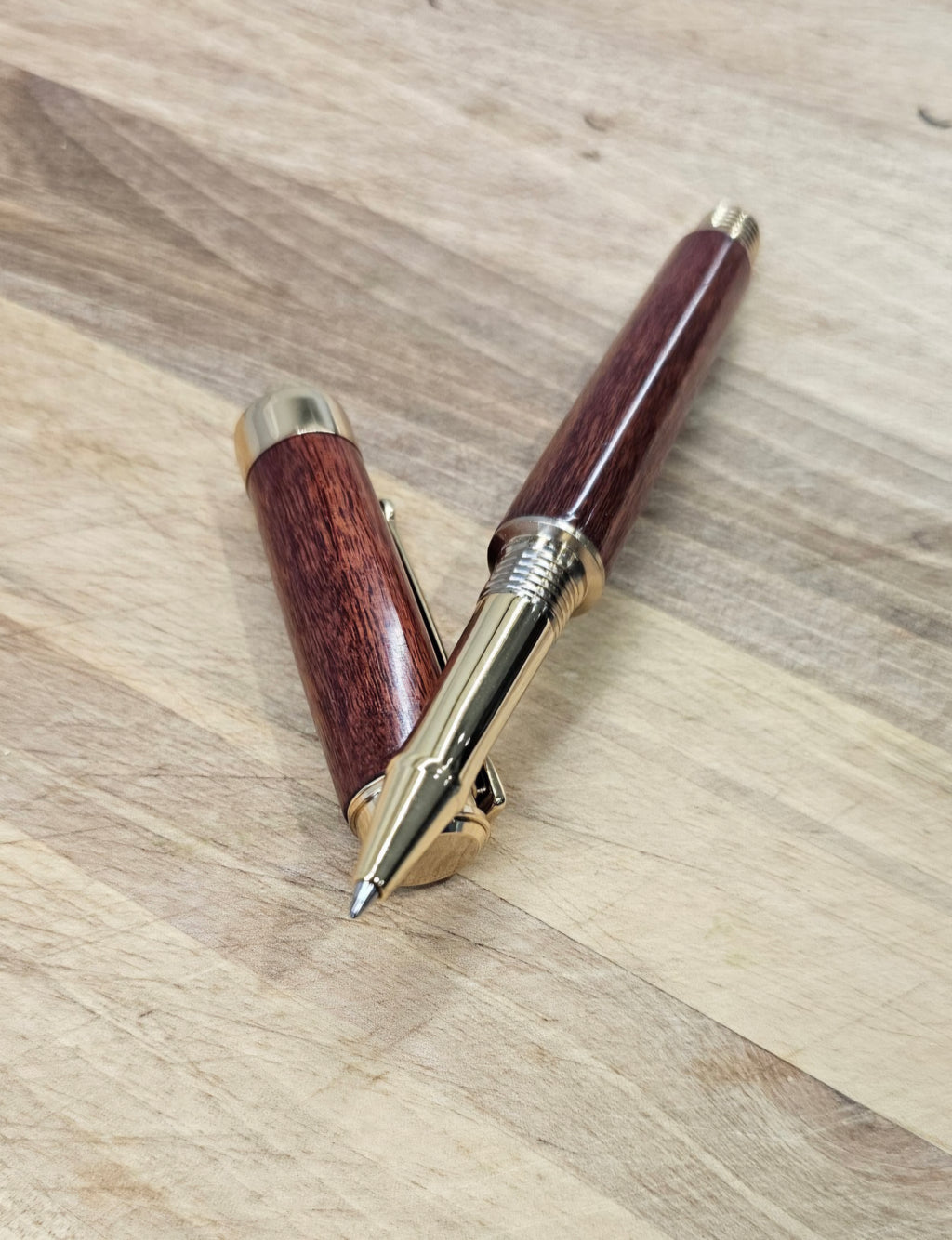 Custom Order Wood turned Rollerball Pen. Finished in Sapele African hardwood with black and red stain