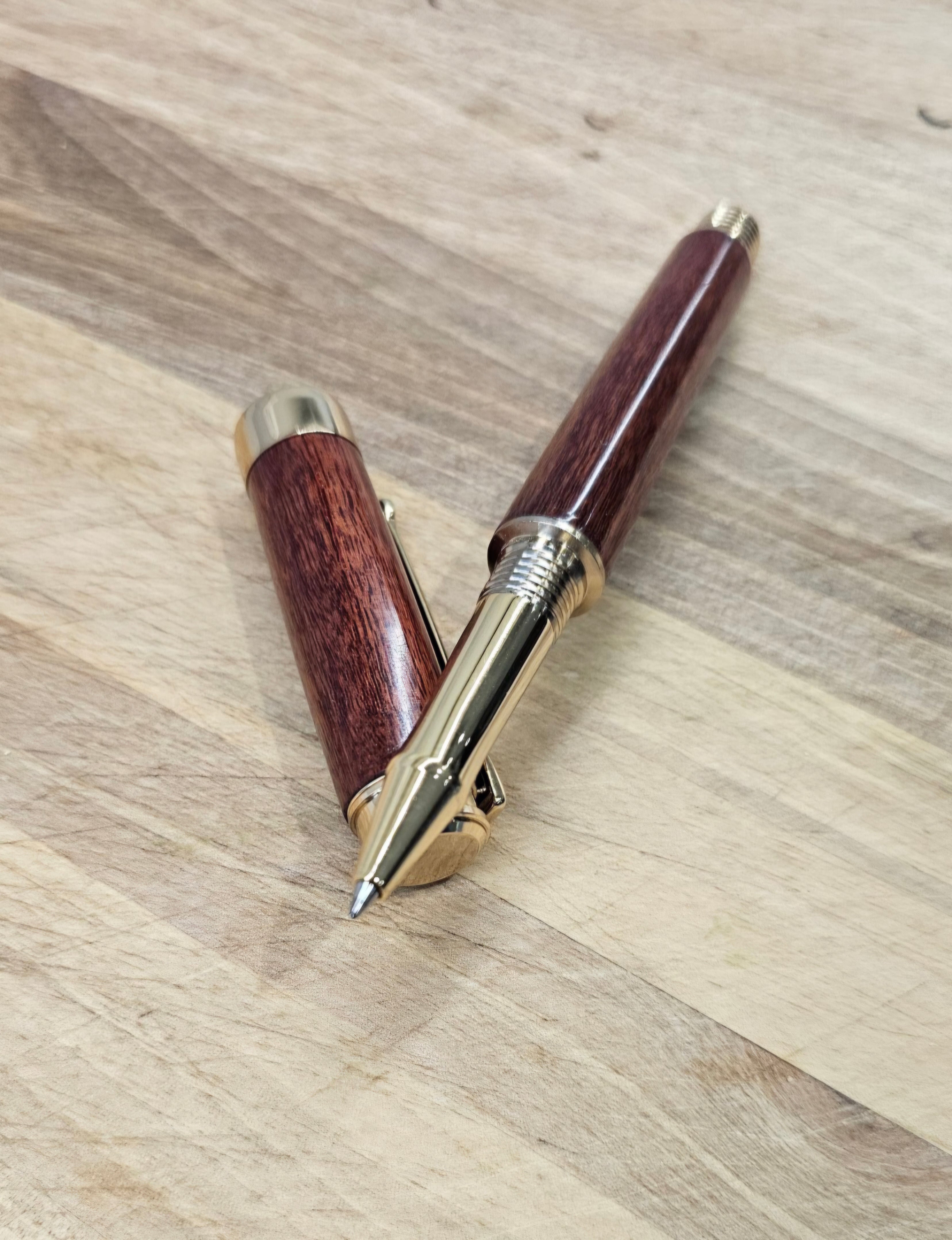 Custom Order Wood turned Rollerball Pen. Finished in Sapele African hardwood with black and red stain