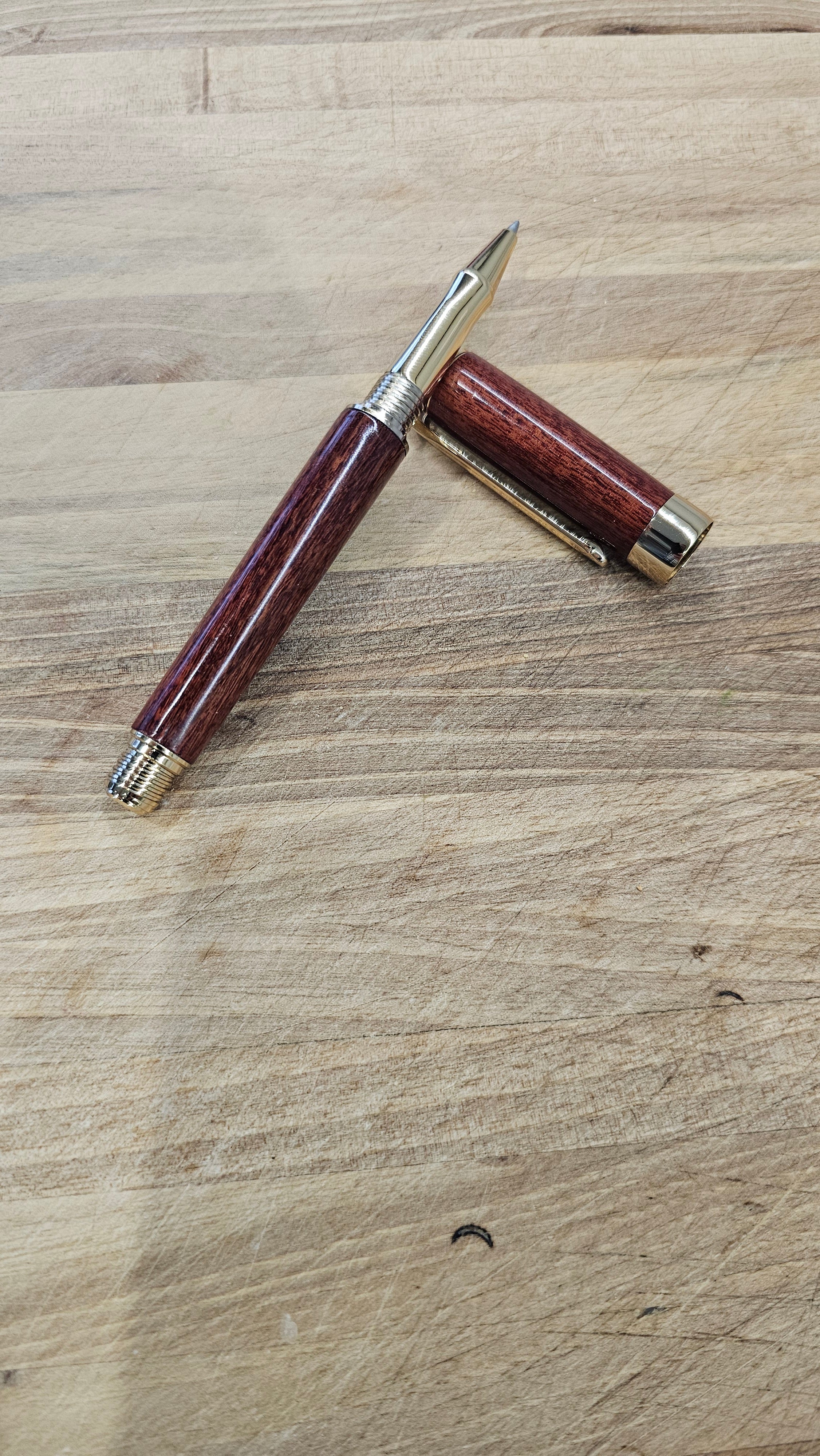 Custom Order Wood turned Rollerball Pen. Finished in Sapele African hardwood with black and red stain