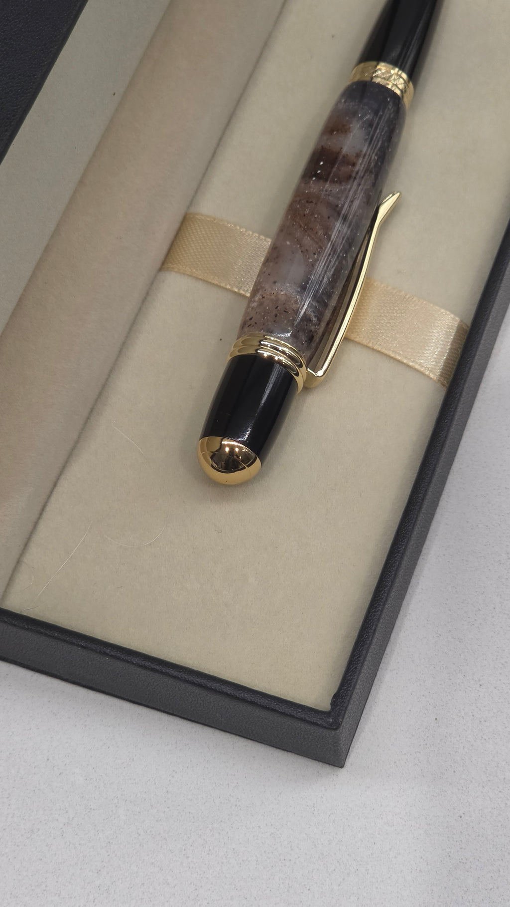 Twist Rollerball pen. Hand turned resin barrel with gold plated trims and clip