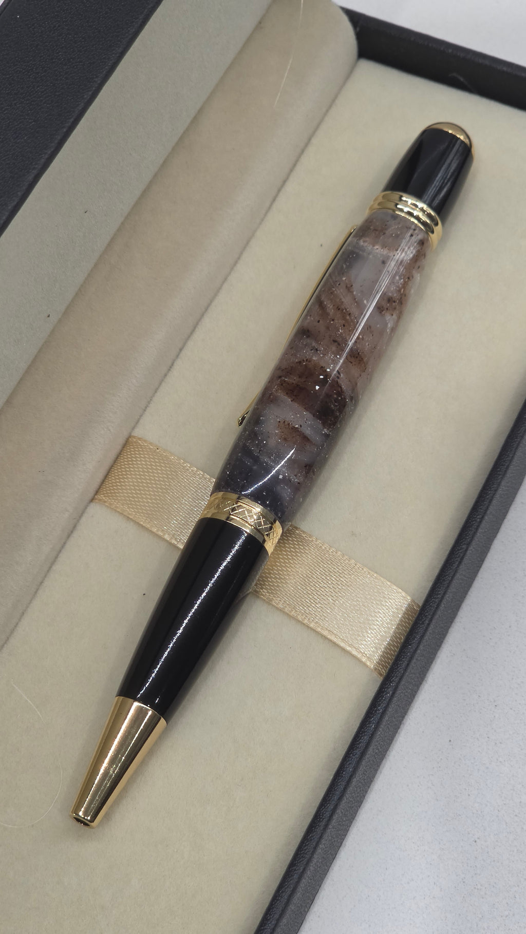 Twist Rollerball pen. Hand turned resin barrel with gold plated trims and clip