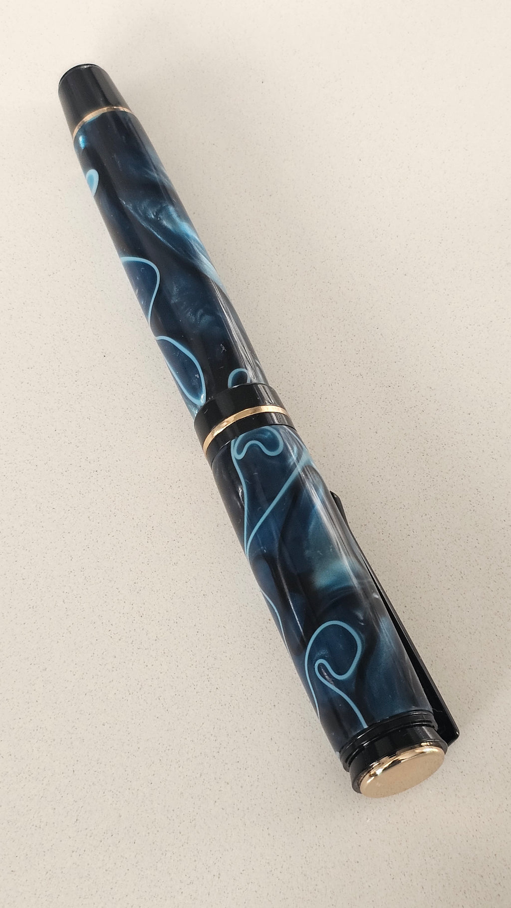 Blue Nebula Fountain Pen. Hand-turned with a deep blue and shimmering silver acrylic resin .