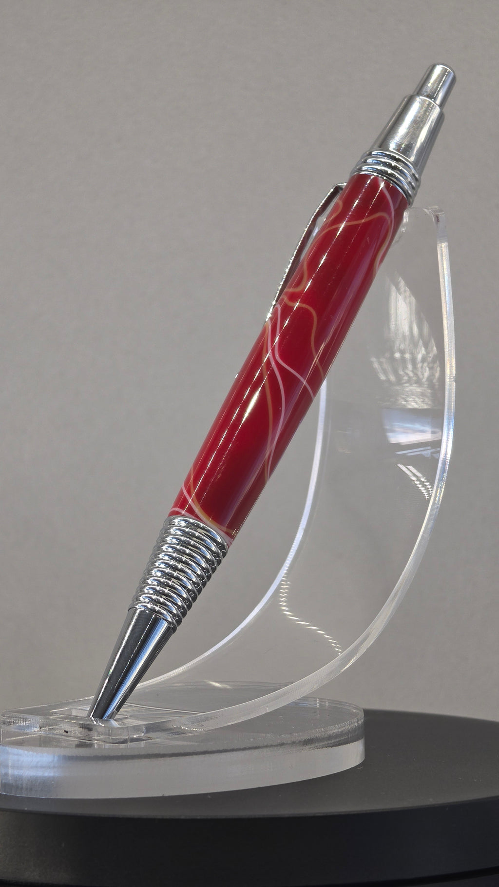 Red and White hand turned resin click rollerball pen.