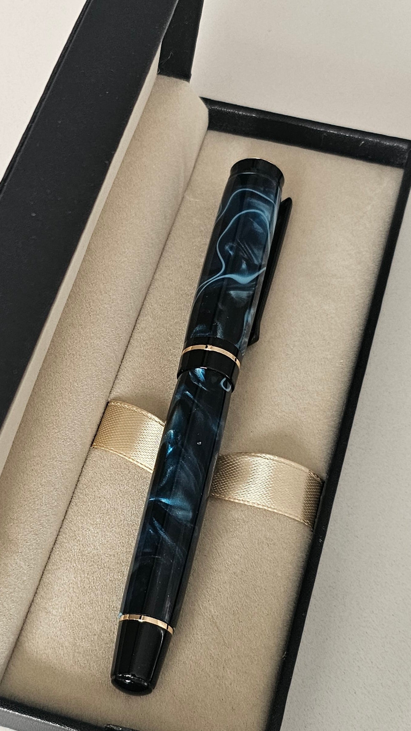 Blue Nebula Fountain Pen. Hand-turned with a deep blue and shimmering silver acrylic resin .
