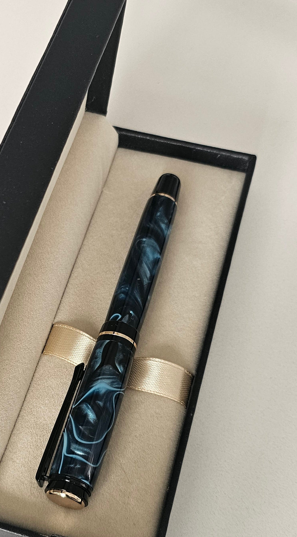 Blue Nebula Fountain Pen. Hand-turned with a deep blue and shimmering silver acrylic resin .