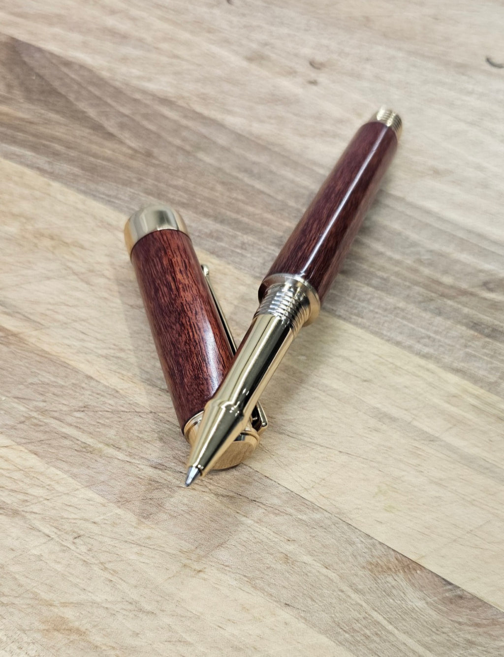 Custom Order Wood turned Rollerball Pen. Finished in Sapele African hardwood with black and red stain