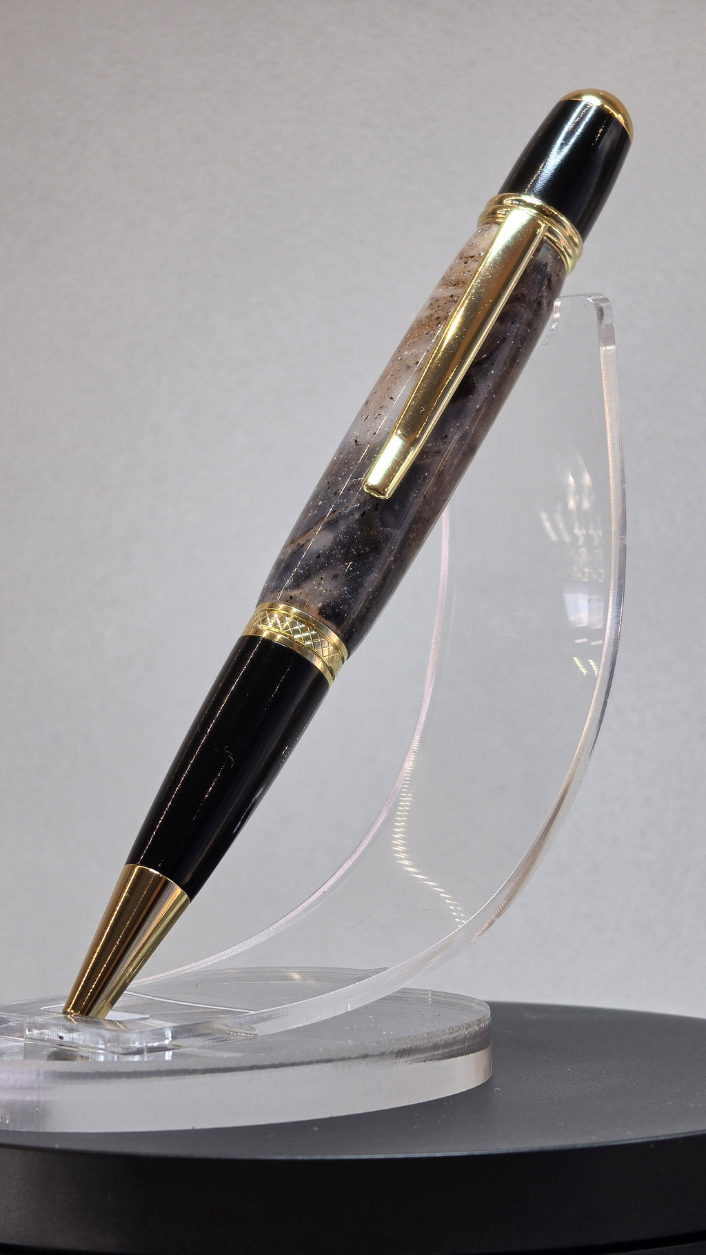 Twist Rollerball pen. Hand turned resin barrel with gold plated trims and clip