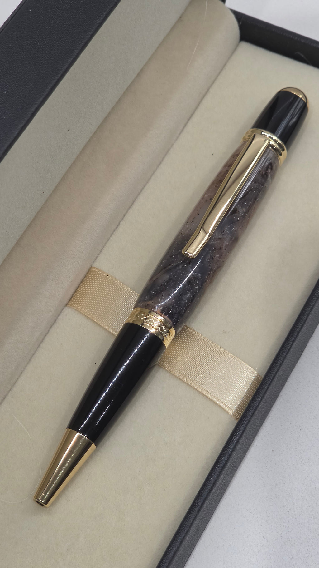 Twist Rollerball pen. Hand turned resin barrel with gold plated trims and clip