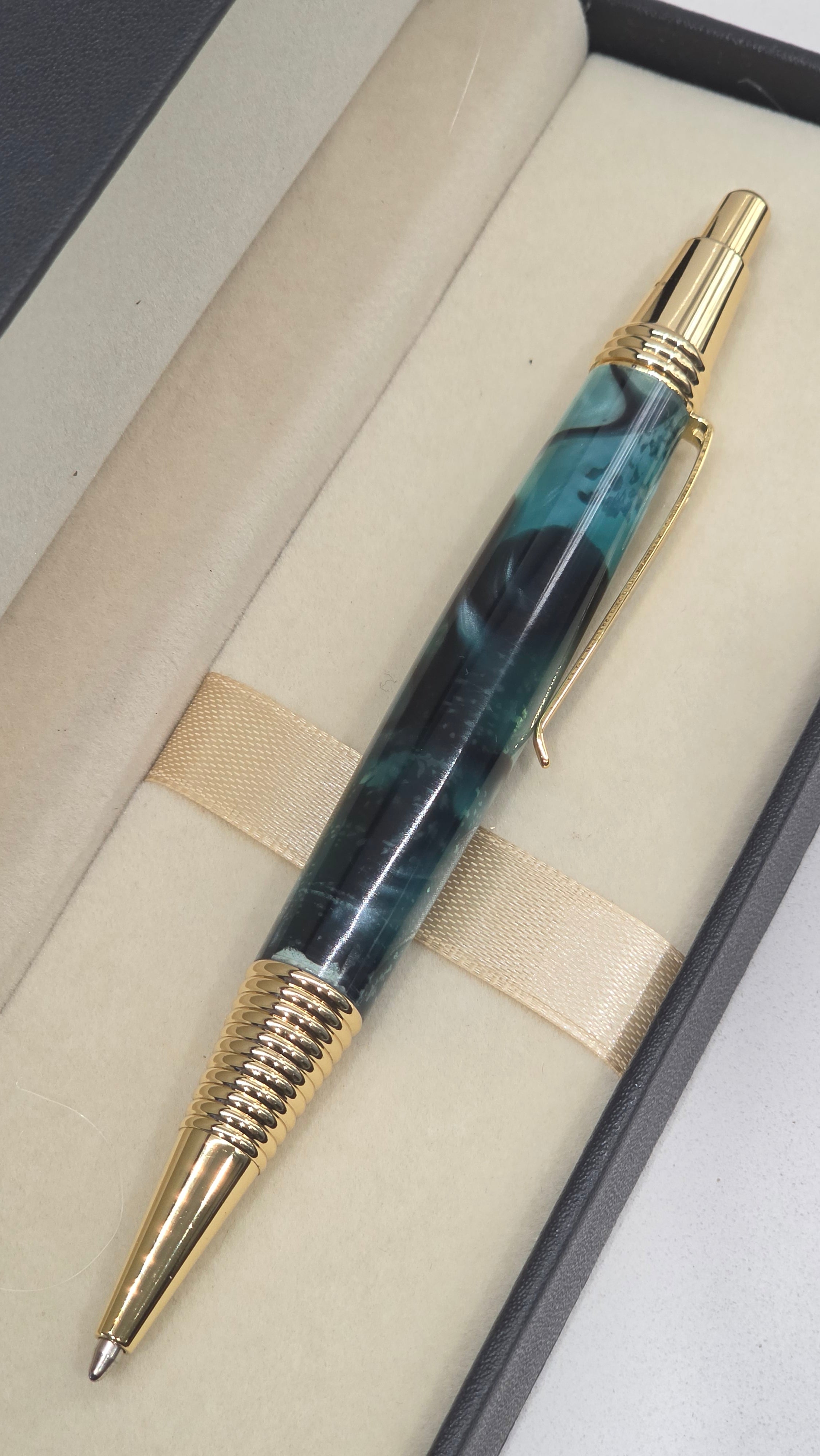Blue and Gold hand turned resin click rollerball pen.