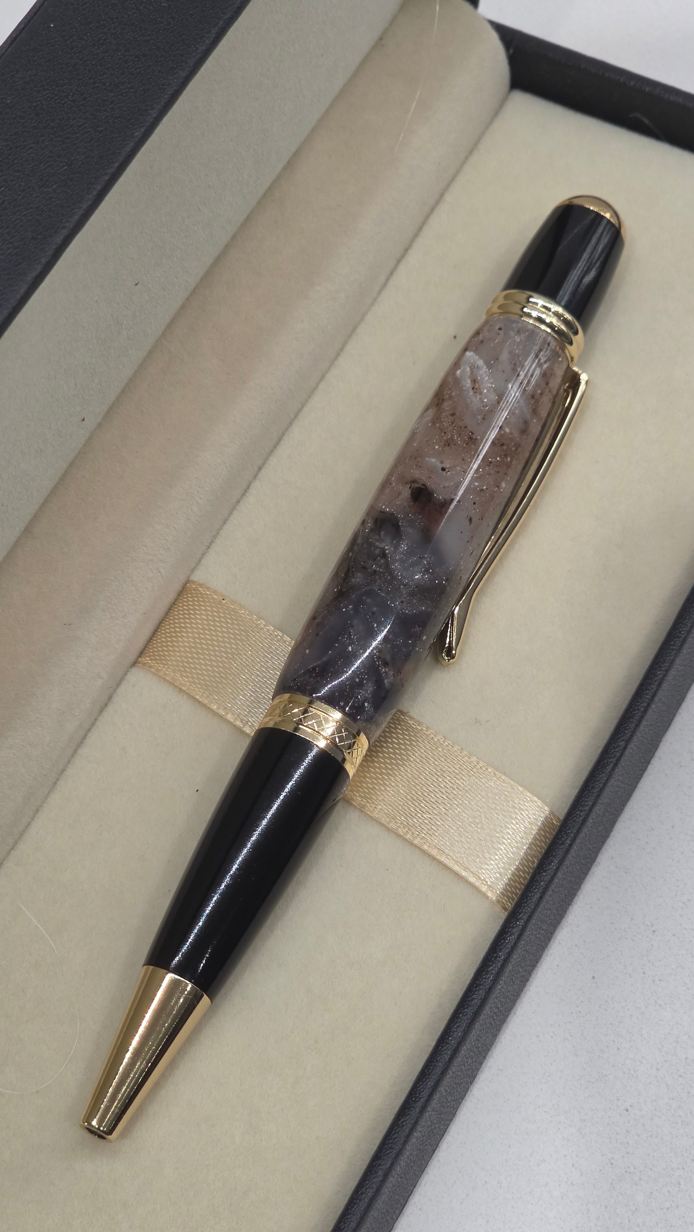 Twist Rollerball pen. Hand turned resin barrel with gold plated trims and clip