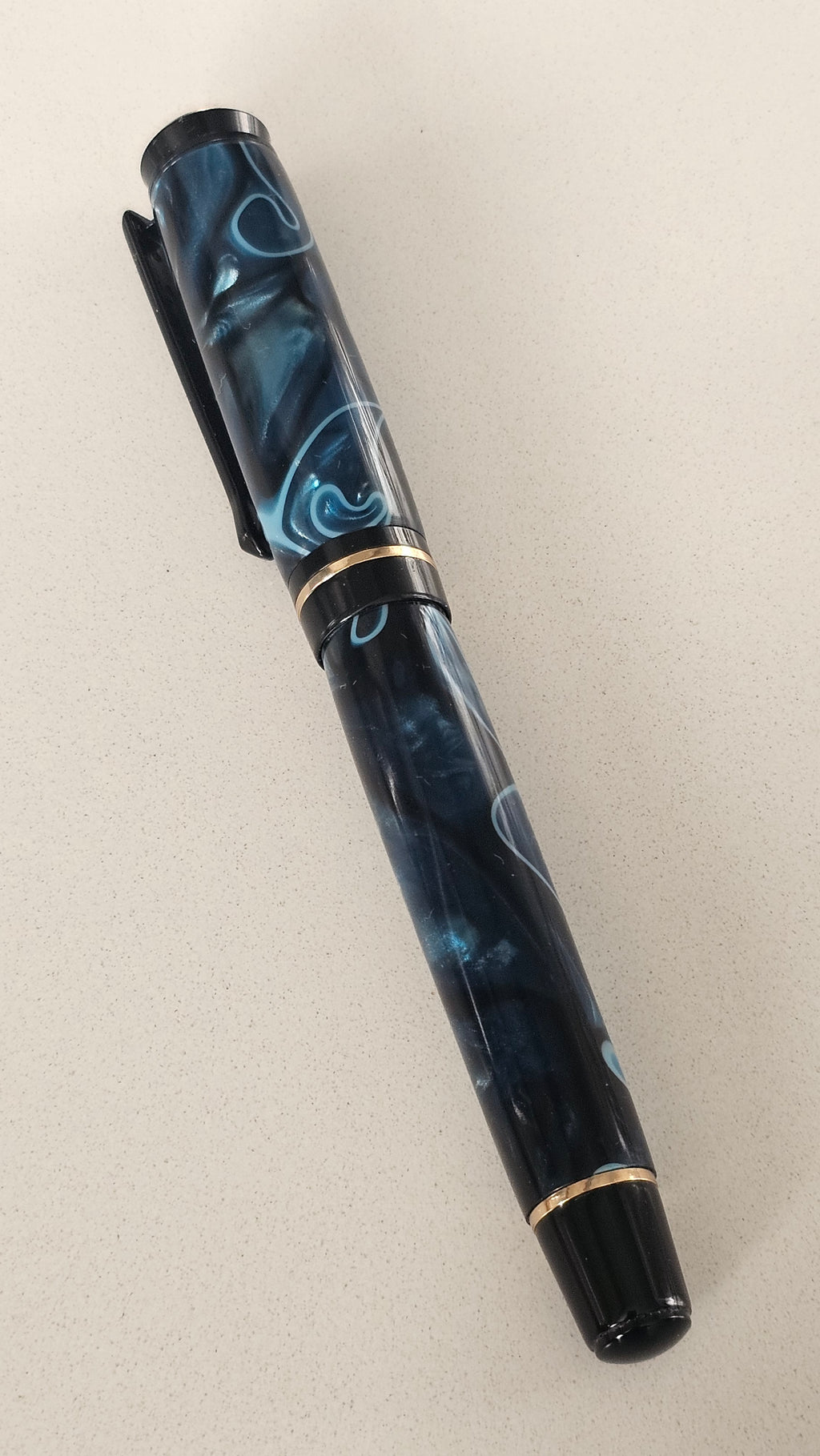 Blue Nebula Fountain Pen. Hand-turned with a deep blue and shimmering silver acrylic resin .