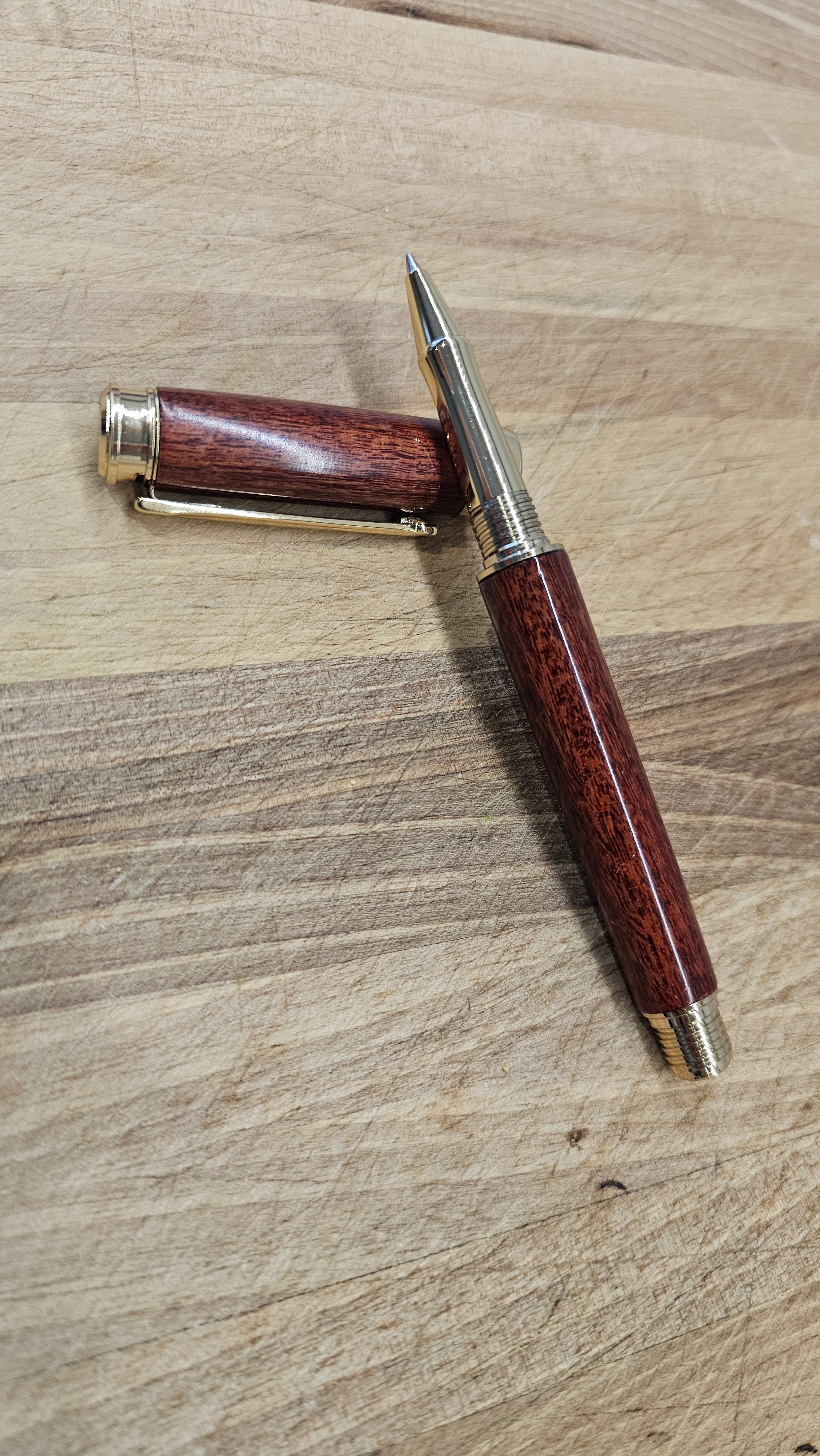 Custom Order Wood turned Rollerball Pen. Finished in Sapele African hardwood with black and red stain