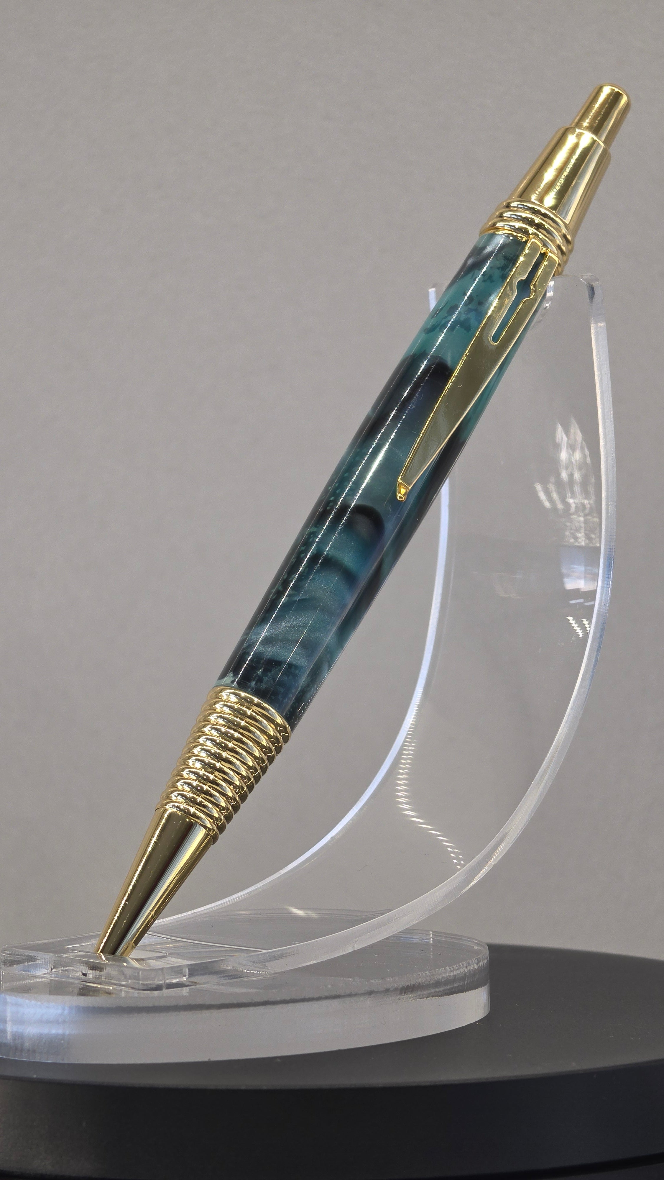 Blue and Gold hand turned resin click rollerball pen.