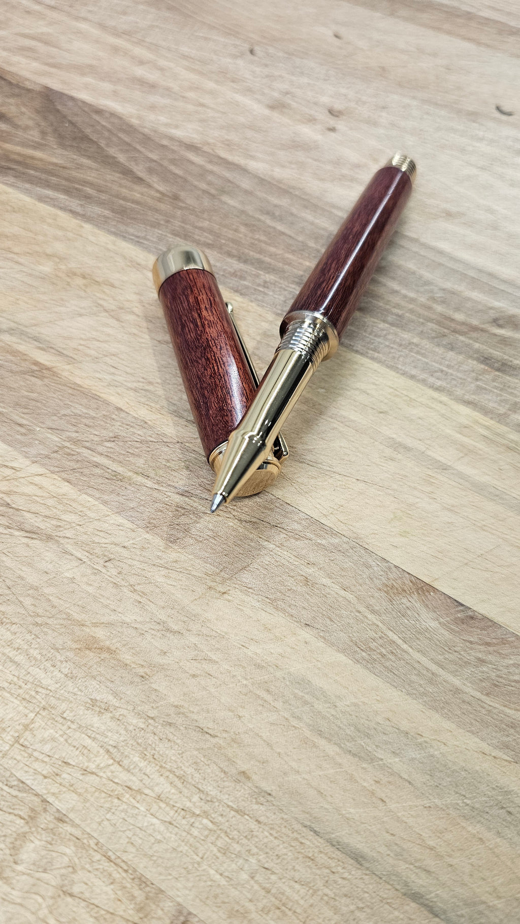 Custom Order Wood turned Rollerball Pen. Finished in Sapele African hardwood with black and red stain