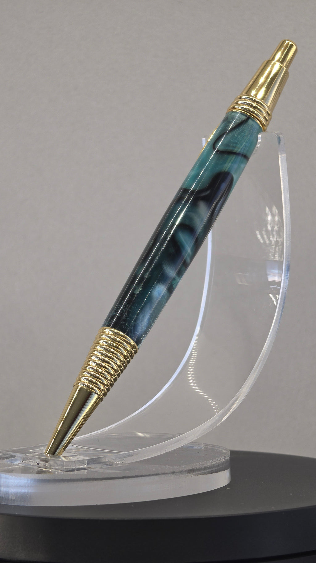 Blue and Gold hand turned resin click rollerball pen.