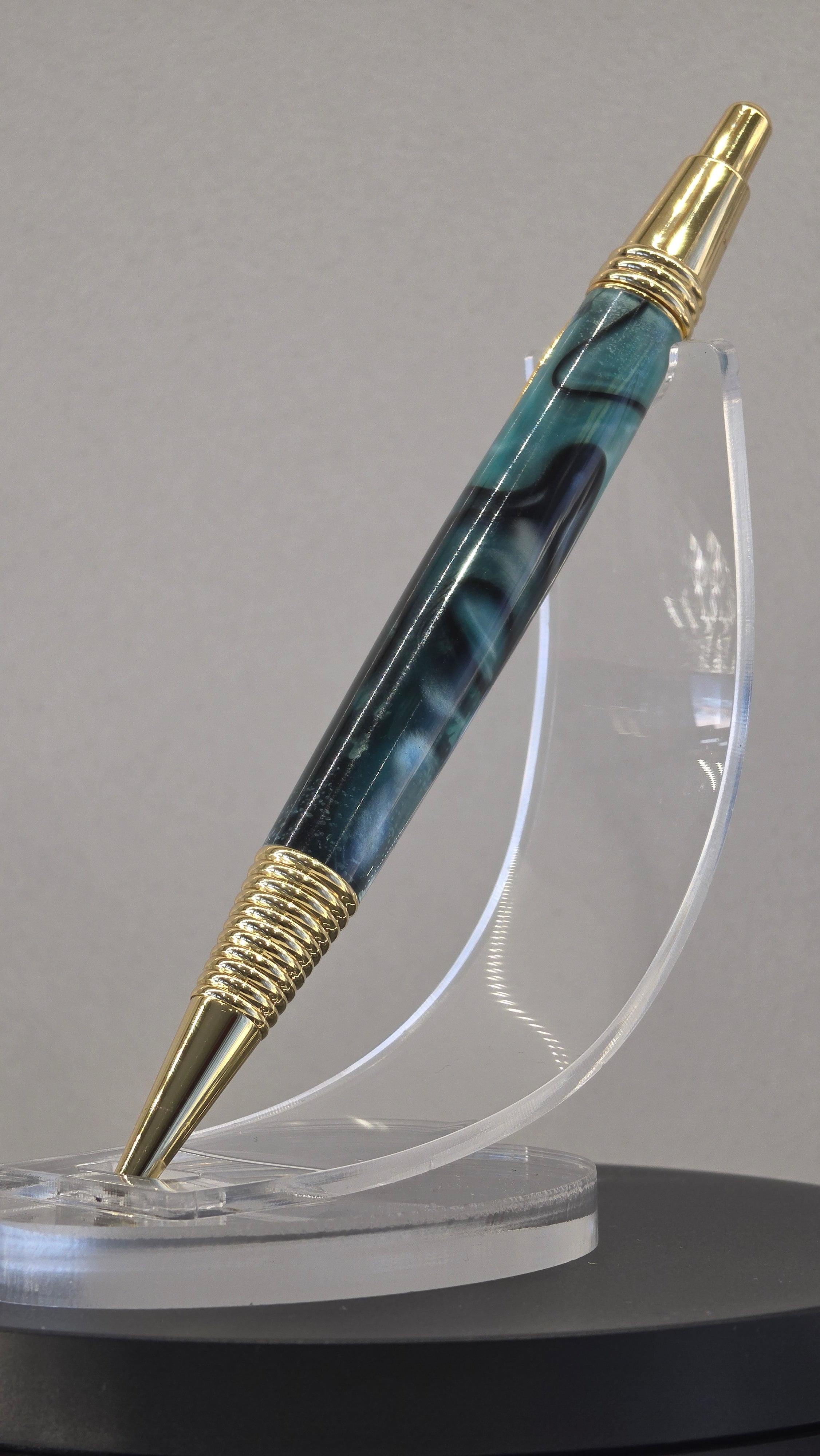 Blue and Gold hand turned resin click rollerball pen.