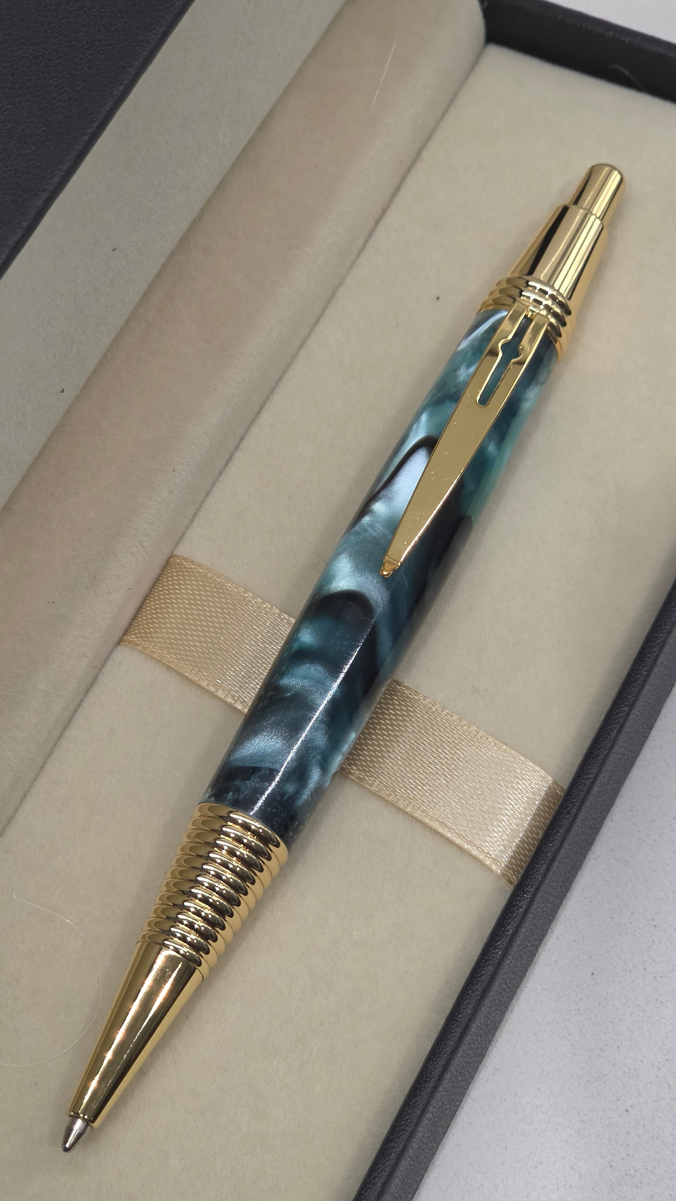 Blue and Gold hand turned resin click rollerball pen.