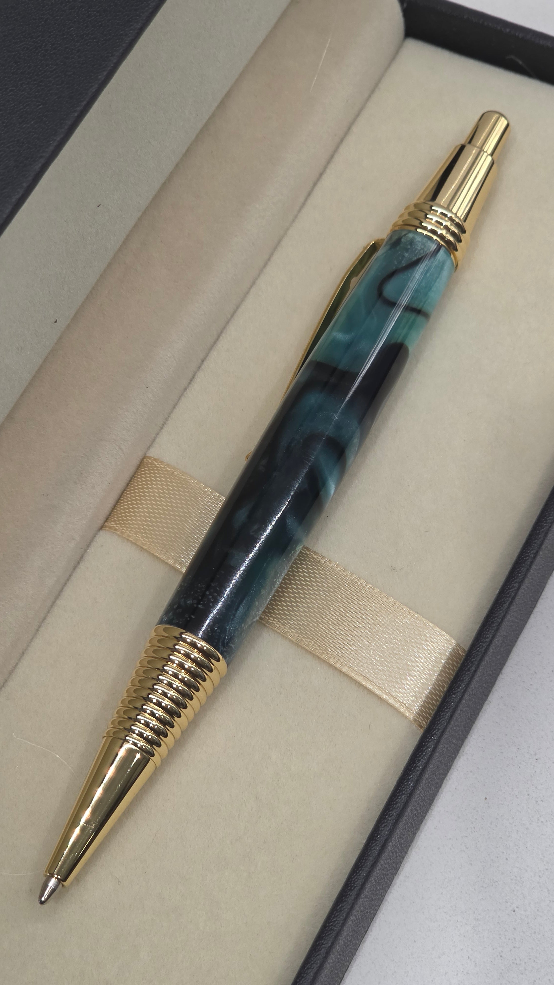 Blue and Gold hand turned resin click rollerball pen.